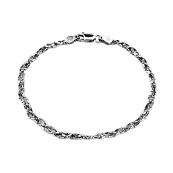 Połyskliwa srebrna bransoletka warkocz fasetowany